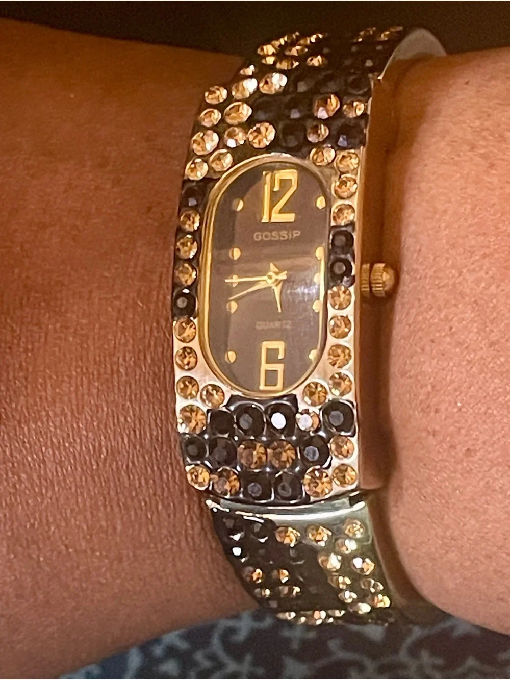 Gossip Gold-Tone Black and Champagne Crystal Bangle Watch. In original box.